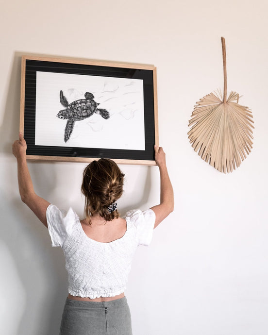 elk draws hanging turtle hatchling limited edition print on white wall