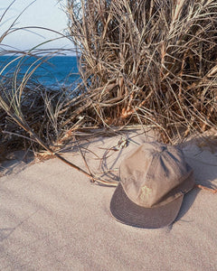 Mocha coffee pot cap by elk draws sitting on sand