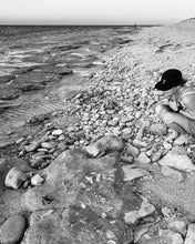Load image into Gallery viewer, Girl on beach wearing elk draws cap watching turtle hatchling