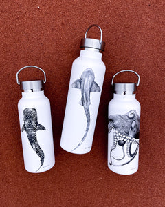 whaleshark leopardshark and octopus drink bottles on red dirt