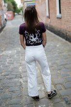 Load image into Gallery viewer, woman in city wearing tshirt with squid on the rear