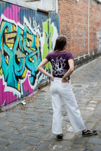 Load image into Gallery viewer, woman in city wearing tshirt with squid on the rear