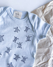 Load image into Gallery viewer, Baby blue organic cotton onesie with turtle hatchlings on it.