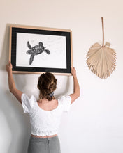 Load image into Gallery viewer, elk draws hanging turtle hatchling limited edition print on white wall