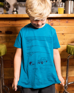 Young boy wearing blue elk draws organic cotton tshirt with troopy camping on it. 
