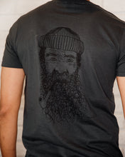 Load image into Gallery viewer, Male wearing elk draws black organic cotton tshirt wih fishman on it.