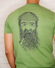 Load image into Gallery viewer, Male wearing elk draws green organic cotton tshirt with a Fisherman on it.