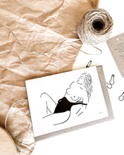 Load image into Gallery viewer, Line art of topless woman at beach in bathing suite on recycled eco friendly green greeting card.