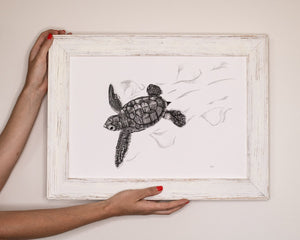 turtle hatchling print by elk draws being held by woman 